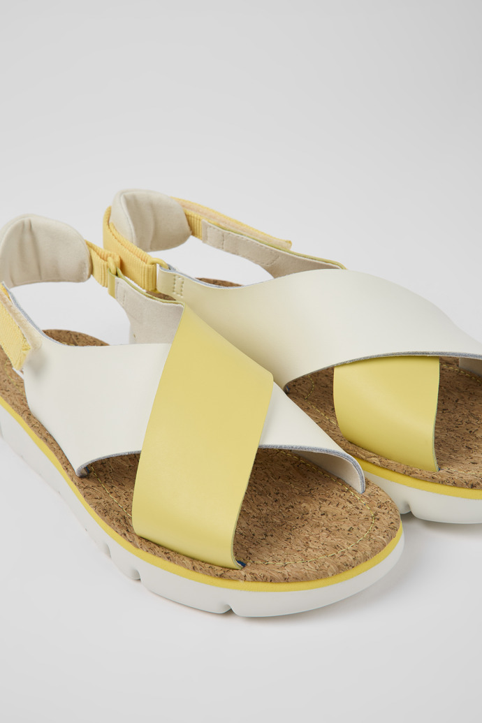 Close-up view of Twins White and yellow leather and textile sandals for women