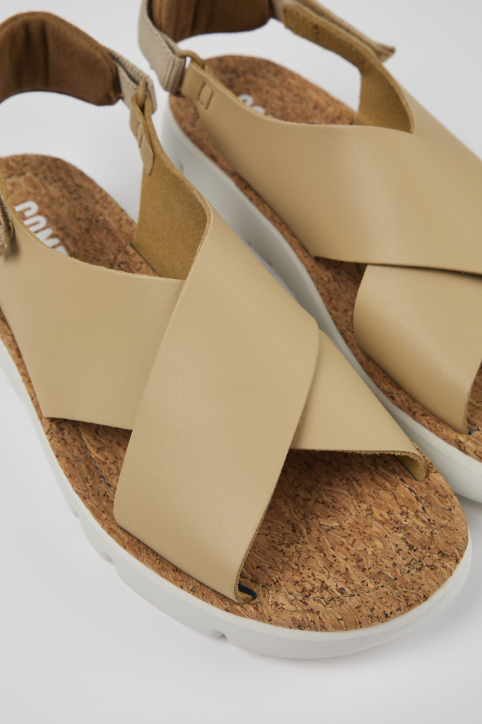 Close-up view of Oruga Beige Leather/Textile Sandal for Women