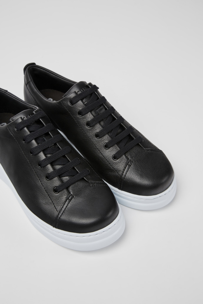 Close-up view of Runner Up Black Leather Sneaker for Women