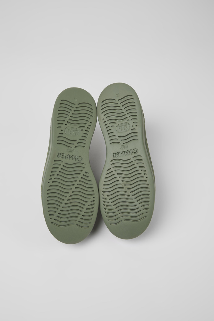 The soles of Runner Up Green leather sneakers for women
