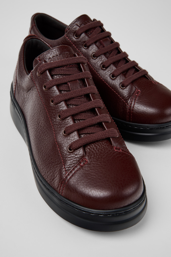 Close-up view of Runner Up Burgundy Leather Sneakers for Women.