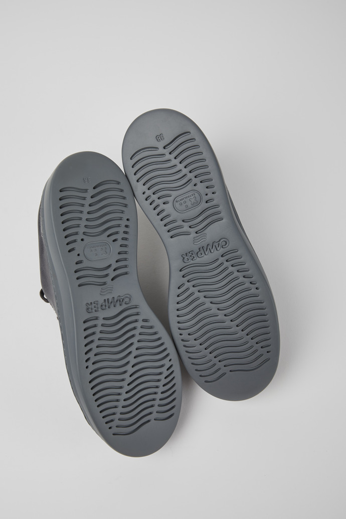 The soles of Runner Up Grey metallic sneaker for women