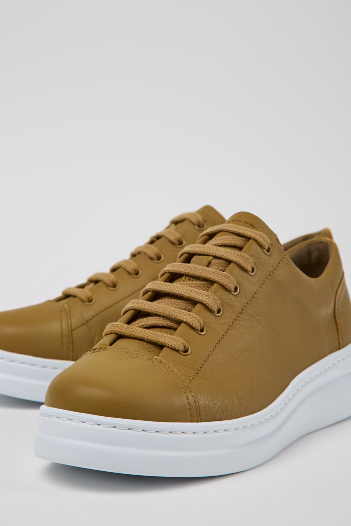 Close-up view of Runner Up Brown leather sneakers for women