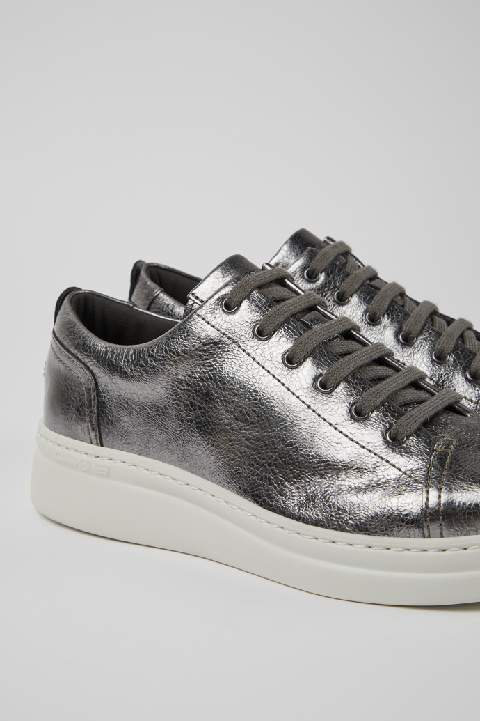 Close-up view of Runner Up Gray metallic leather sneakers for women