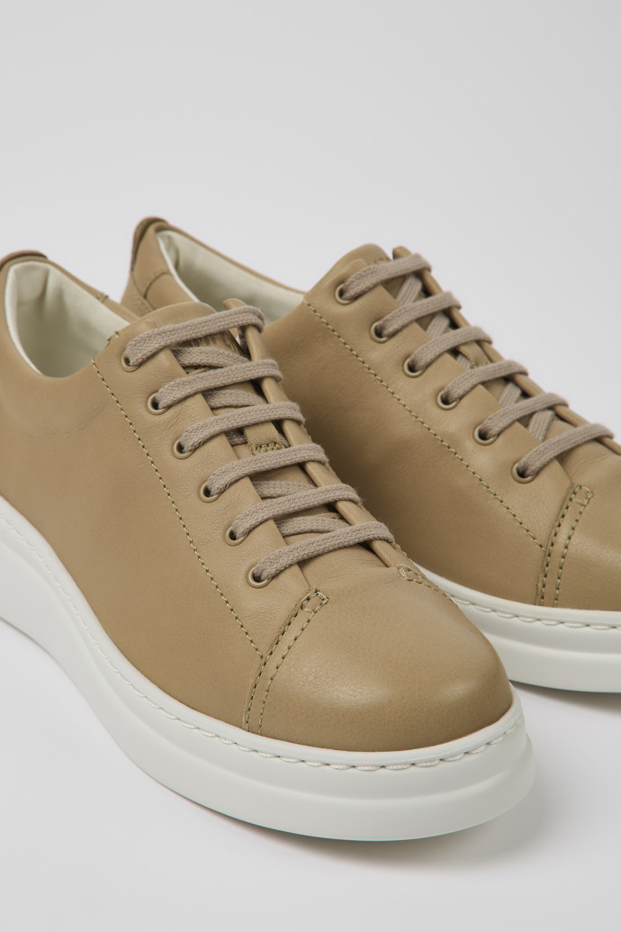 Close-up view of Runner Up Beige leather sneakers for women