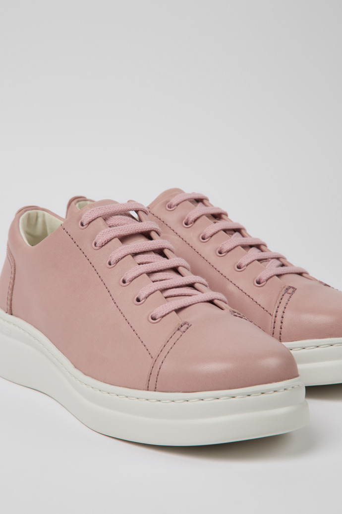 Close-up view of Runner Up Pink leather sneakers for women