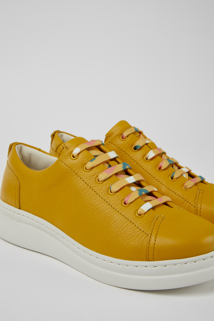 Close-up view of Runner Up Yellow leather sneakers for women