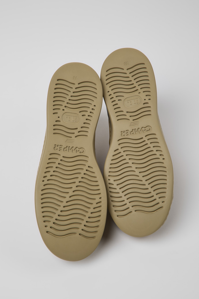 The soles of Runner Up Brown nubuck sneakers for women
