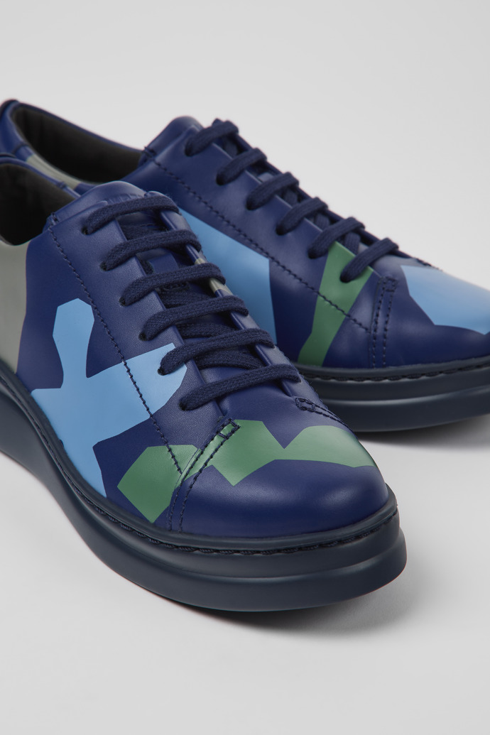 Close-up view of Twins Blue and green printed leather sneakers for women