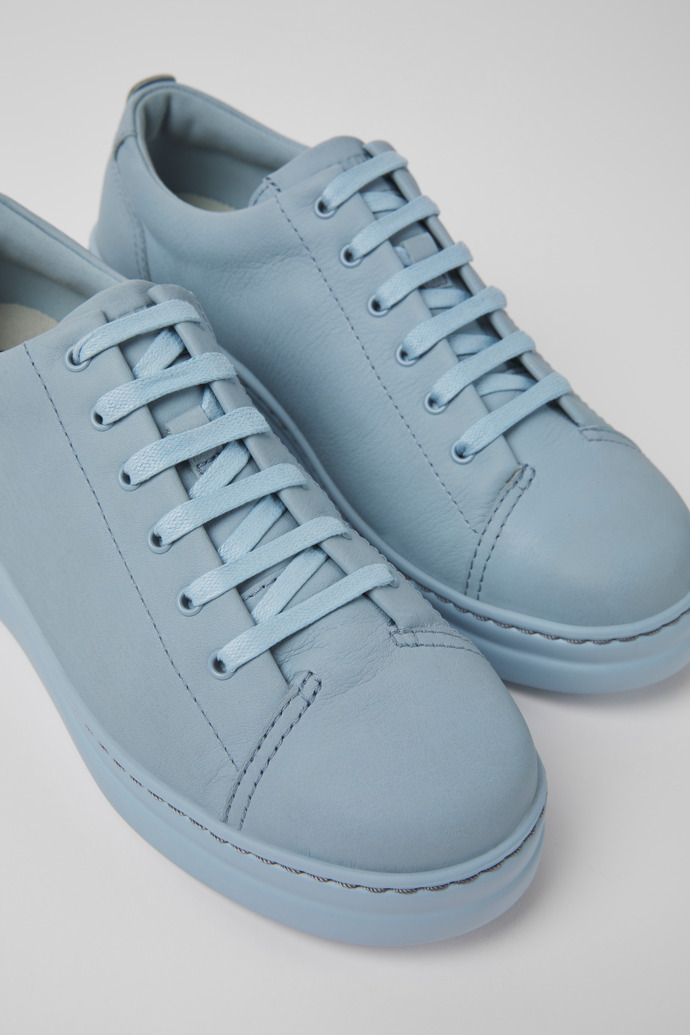 Close-up view of Runner Up Blue leather sneakers for women
