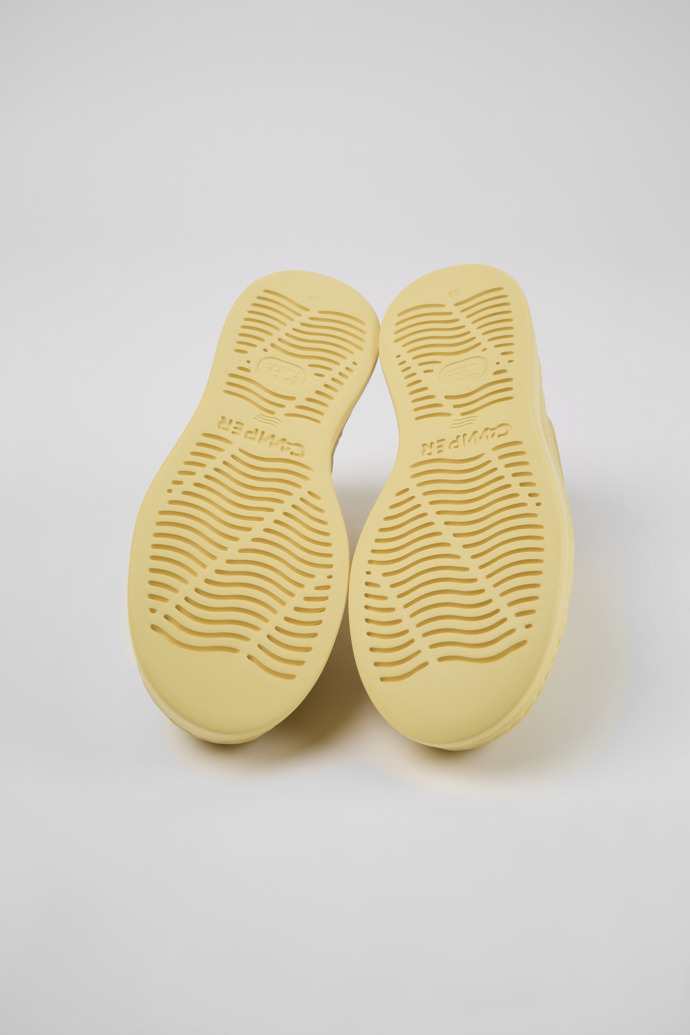 The soles of Runner Up Yellow nubuck sneakers for women