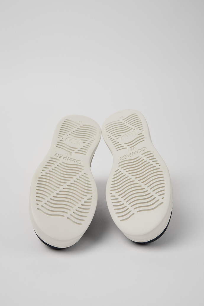 The soles of Runner Up Blue Nubuck Sneakers for Women.