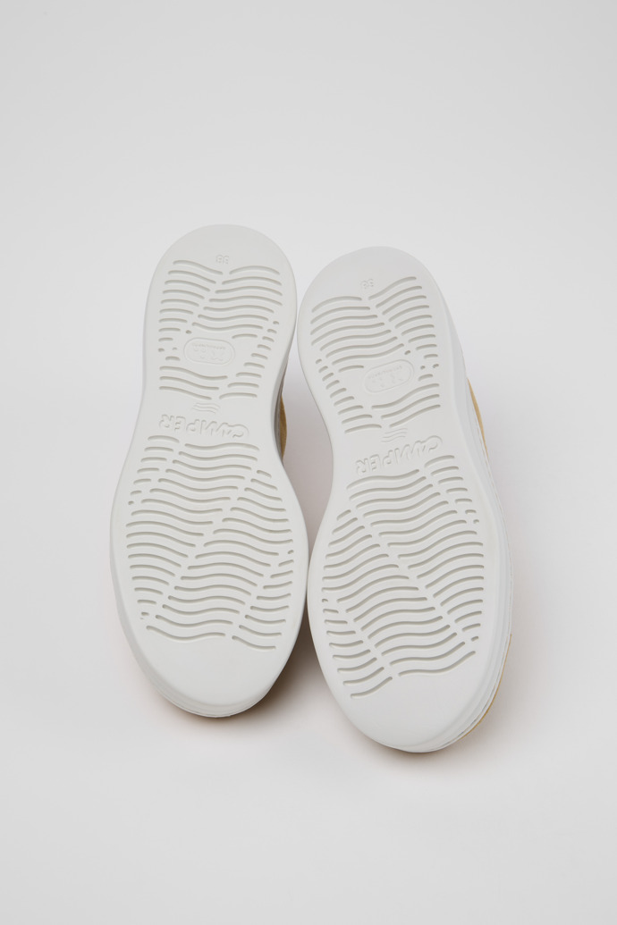 The soles of Runner Up Brown Suede Sneakers for Women.