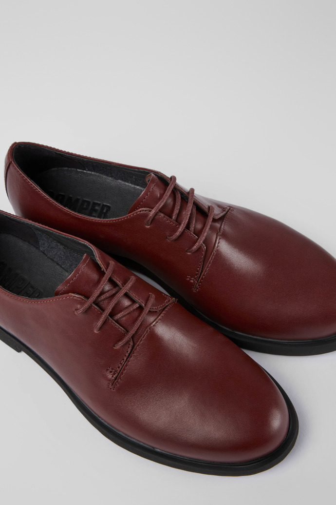 Close-up view of Iman Burgundy leather shoes