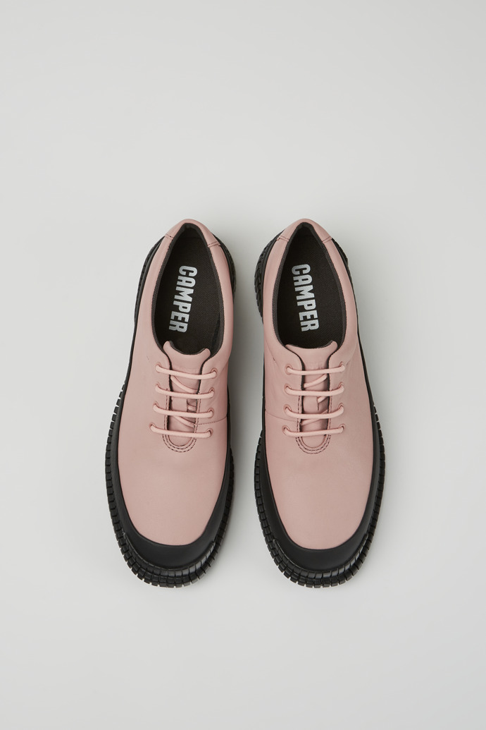 Overhead view of Pix Pink and black leather lace-up shoes for women