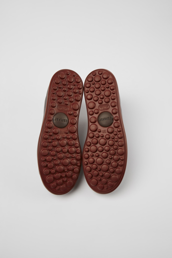 The soles of Pelotas XLite Burgundy leather shoes for women