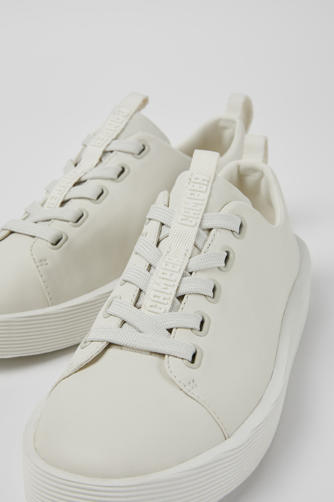 Close-up view of Courb White leather sneakers for women