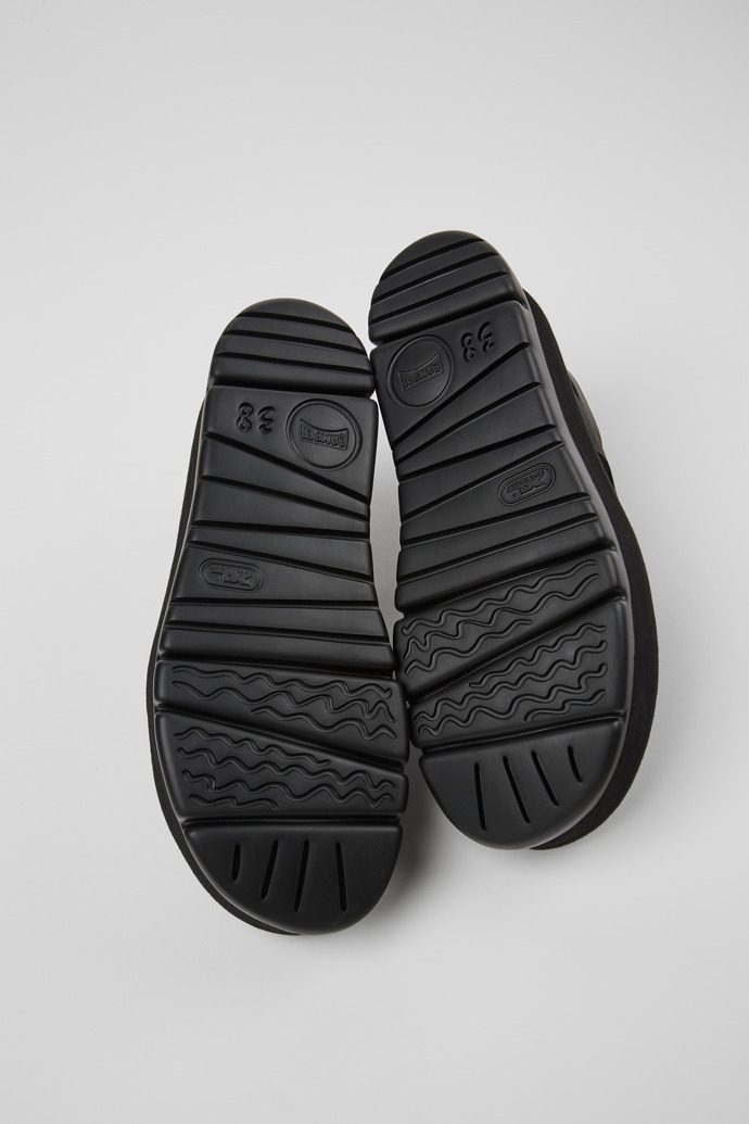 The soles of Oruga Up Black Sandal for Women