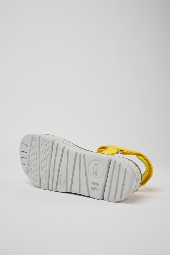 The soles of Oruga Up Yellow recycled PET sandals for women