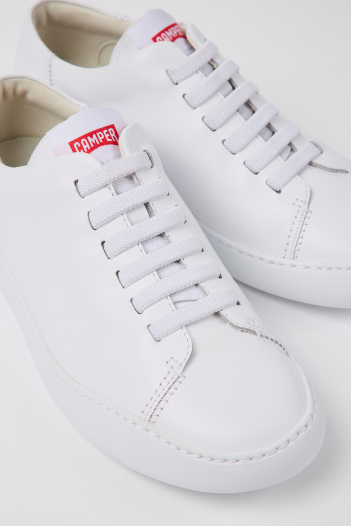Close-up view of Peu Touring Women's white sneaker
