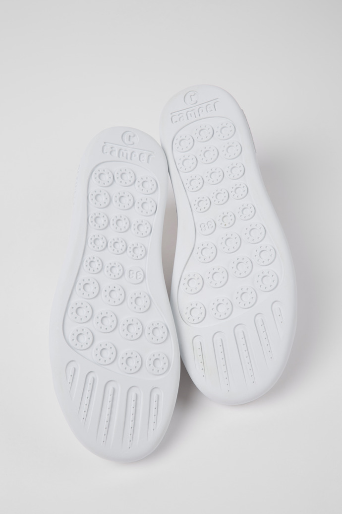 The soles of Peu Touring Women's white sneaker