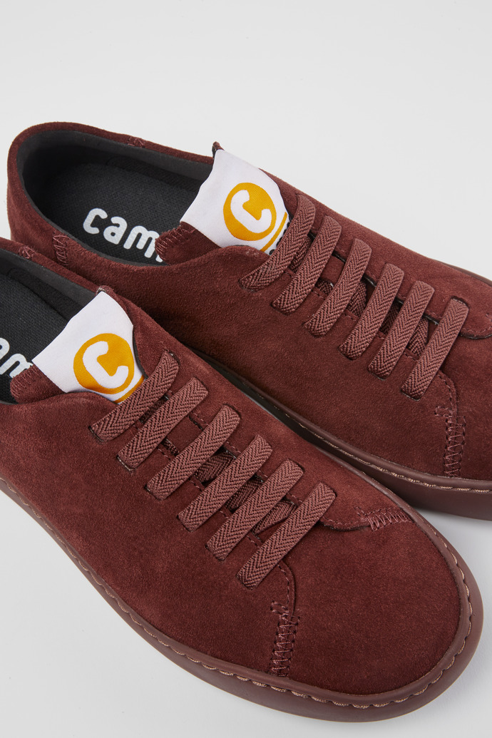 Close-up view of Peu Touring Burgundy suede sneakers