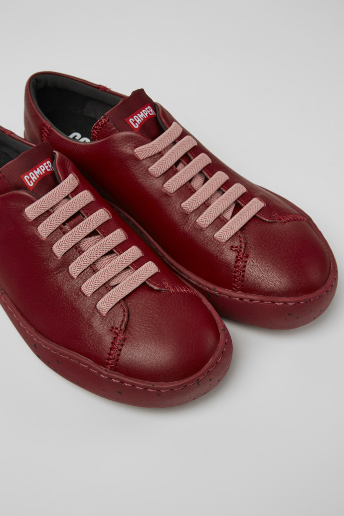 Close-up view of Peu Touring Burgundy leather sneakers for women