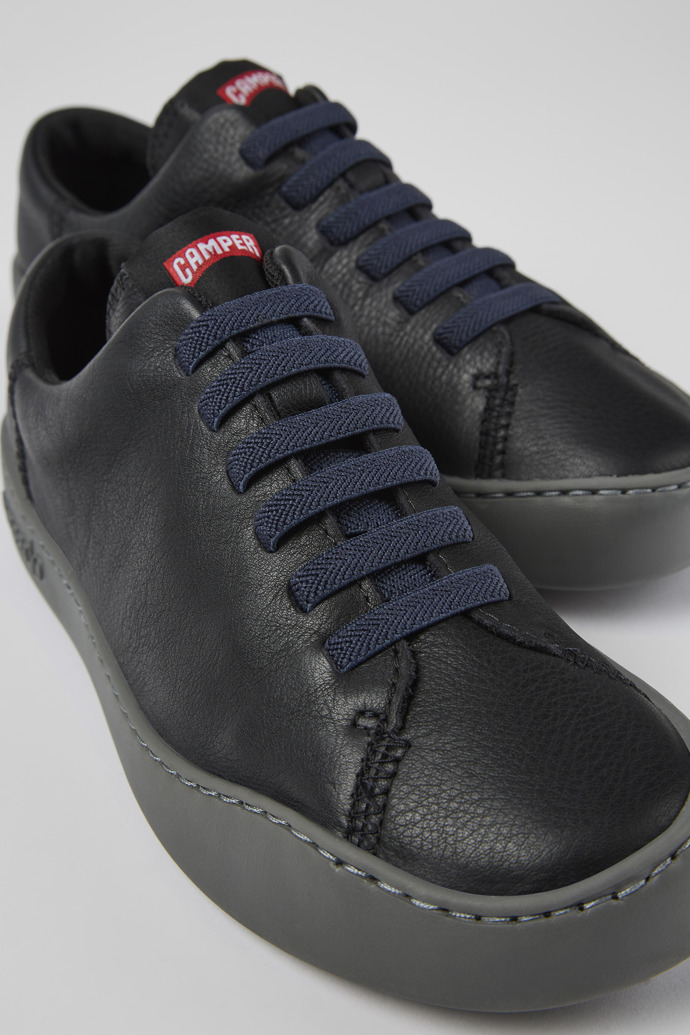 Close-up view of Peu Touring Black leather sneakers for women