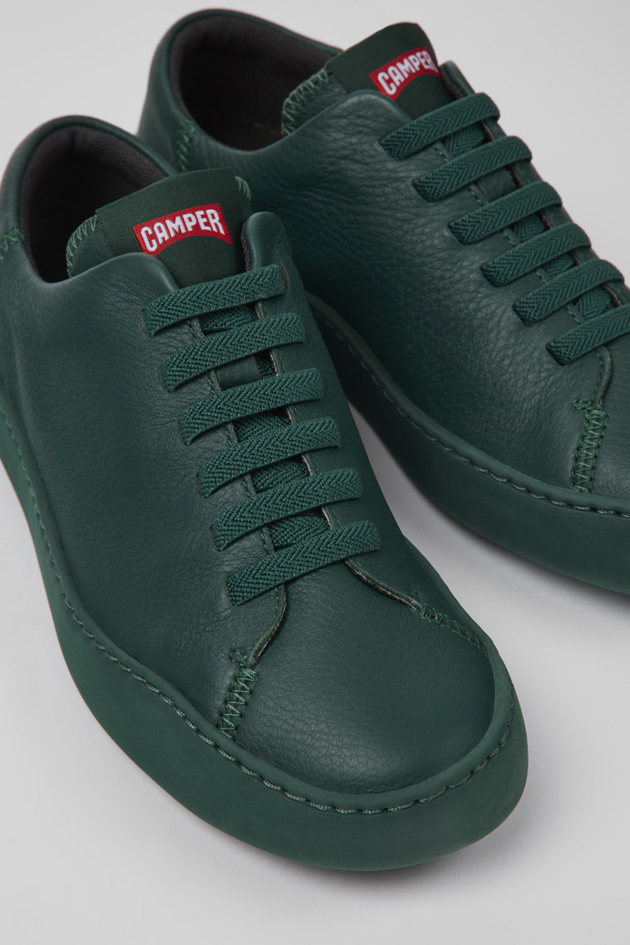 Close-up view of Peu Touring Green leather sneakers for women