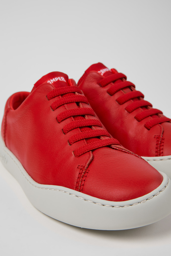 Close-up view of Peu Touring Red Leather Sneakers for Women.