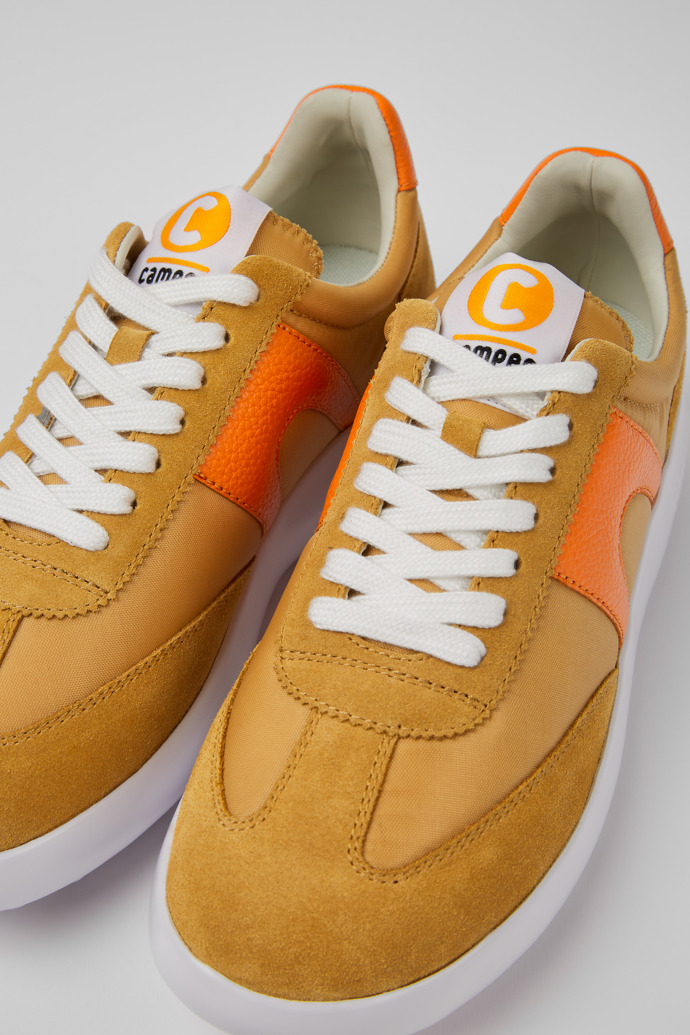 Close-up view of Pelotas XLite Beige and orange sneakers for women