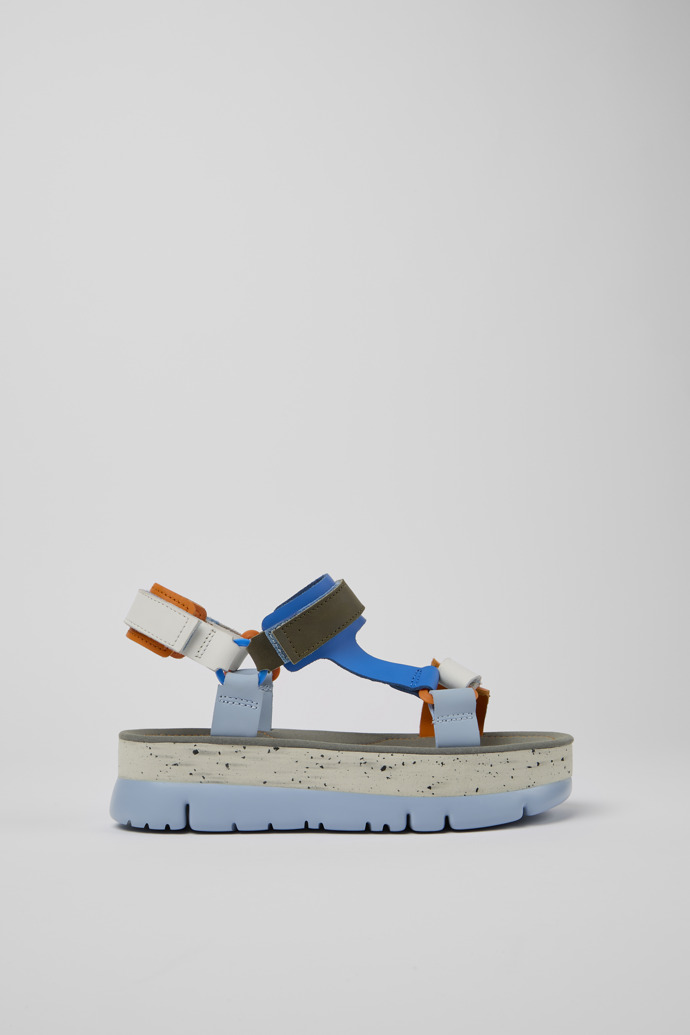 Side view of Oruga Up Blue, orange, and white leather sandals for women