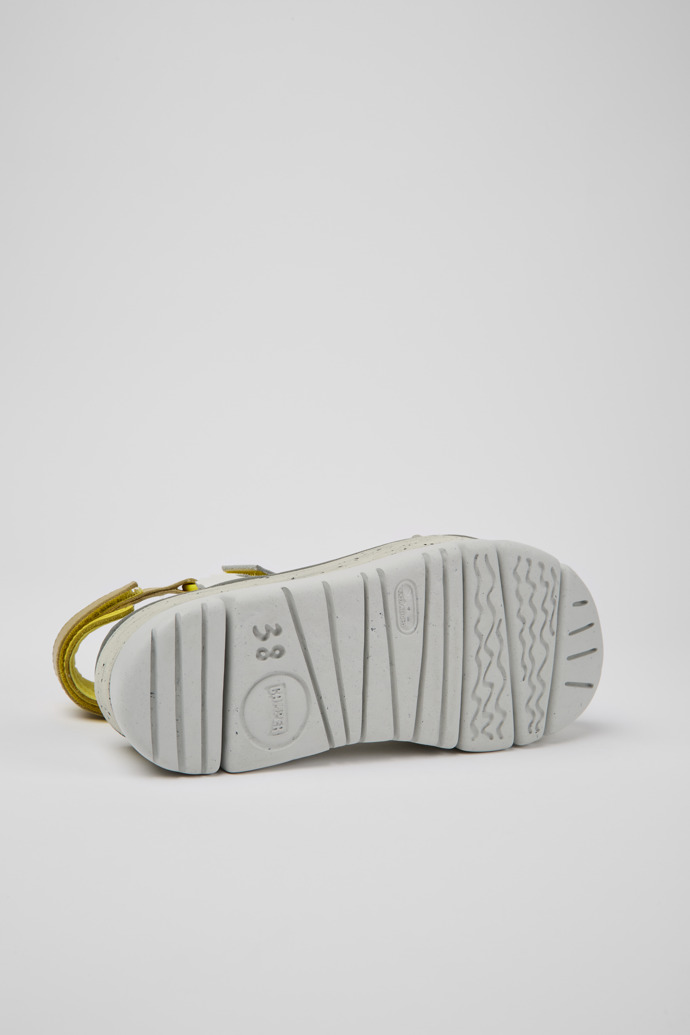 The soles of Oruga Up White, grey, and yellow leather sandals for women