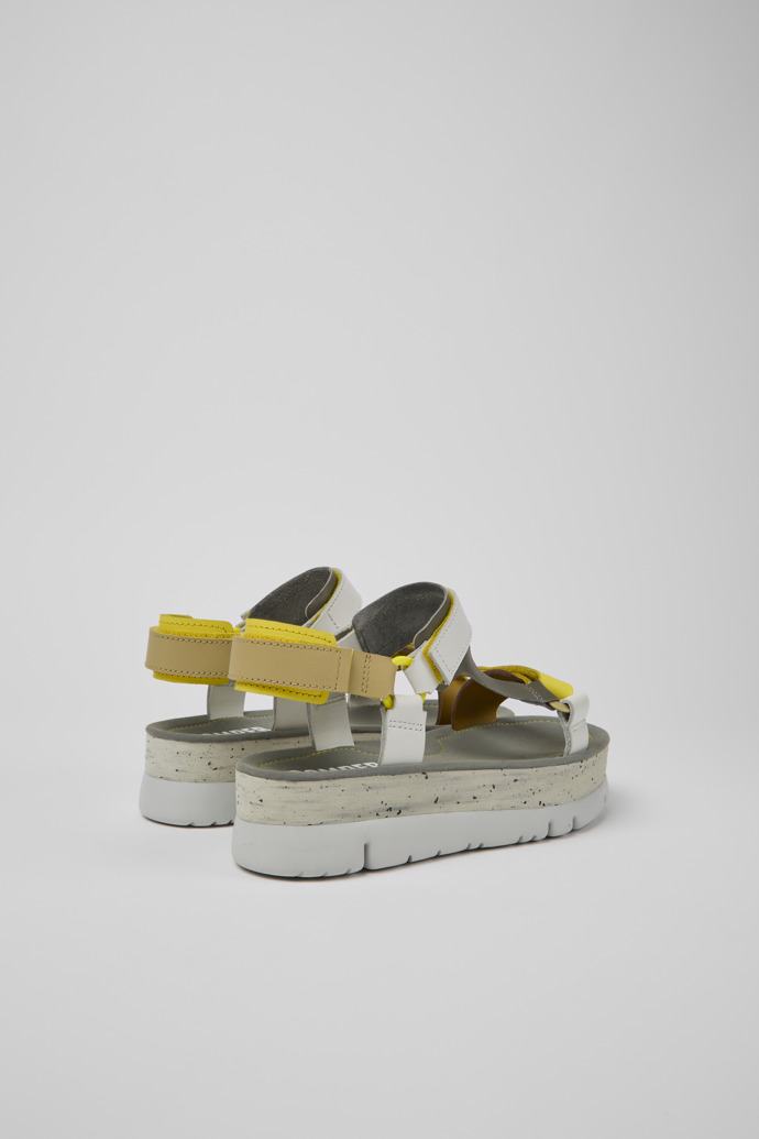Back view of Oruga Up White, grey, and yellow leather sandals for women