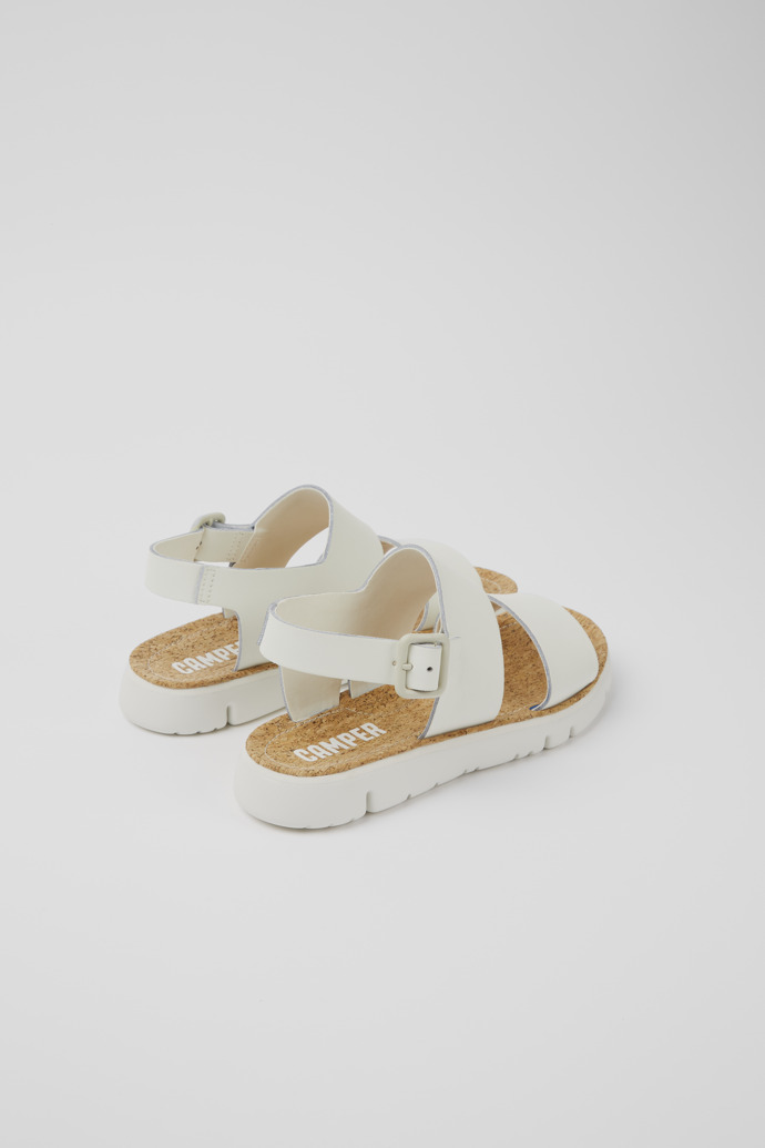 Back view of Oruga White leather sandals for women