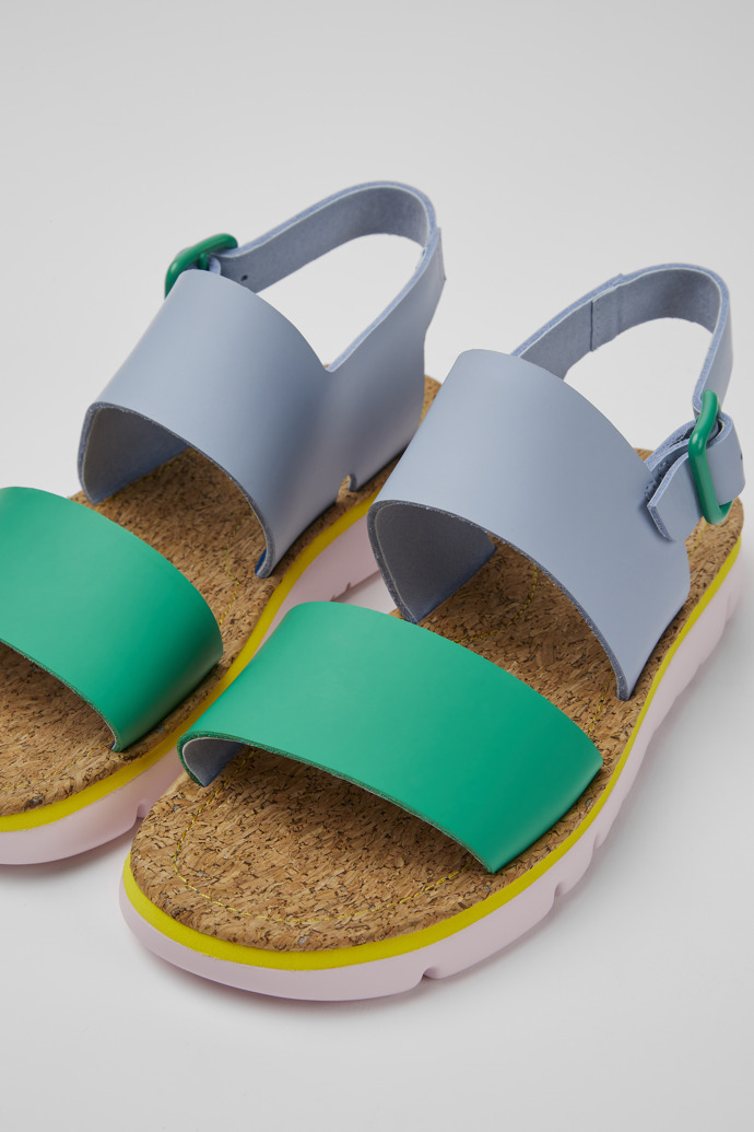 Close-up view of Oruga Blue and green sandals for women