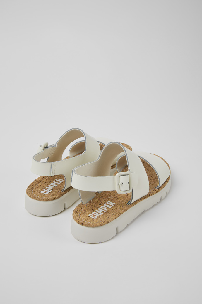 Back view of Oruga White leather sandals for women