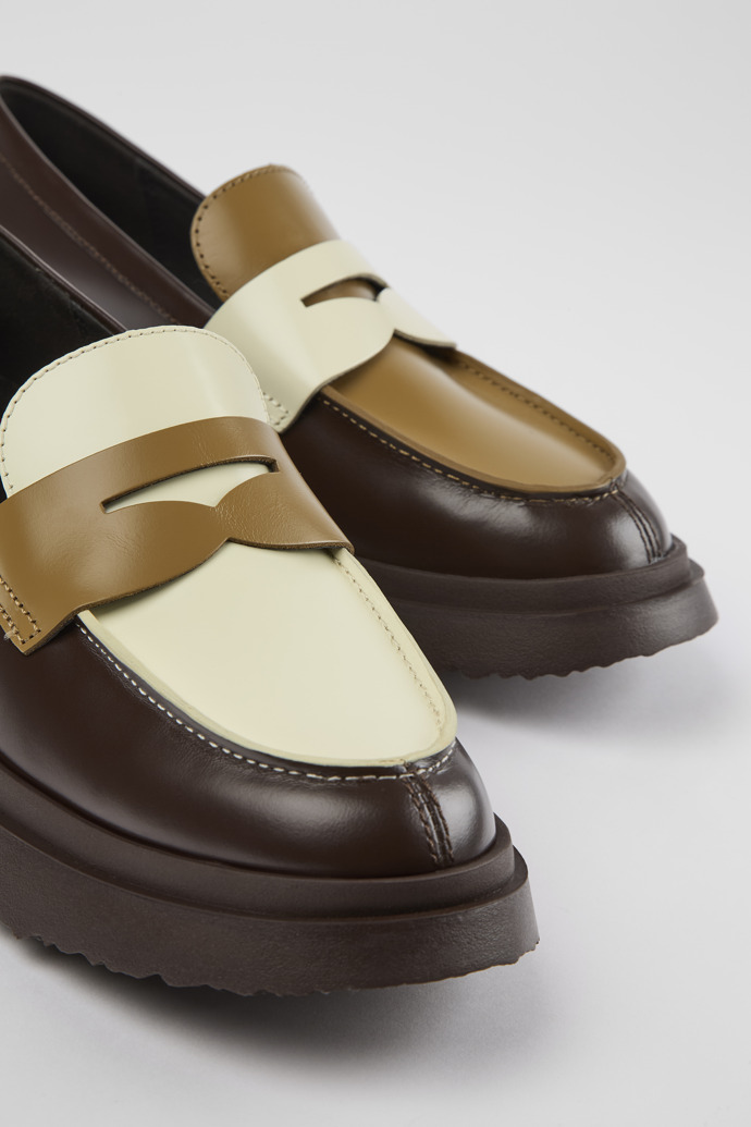 Close-up view of Twins Brown and white leather loafers for women