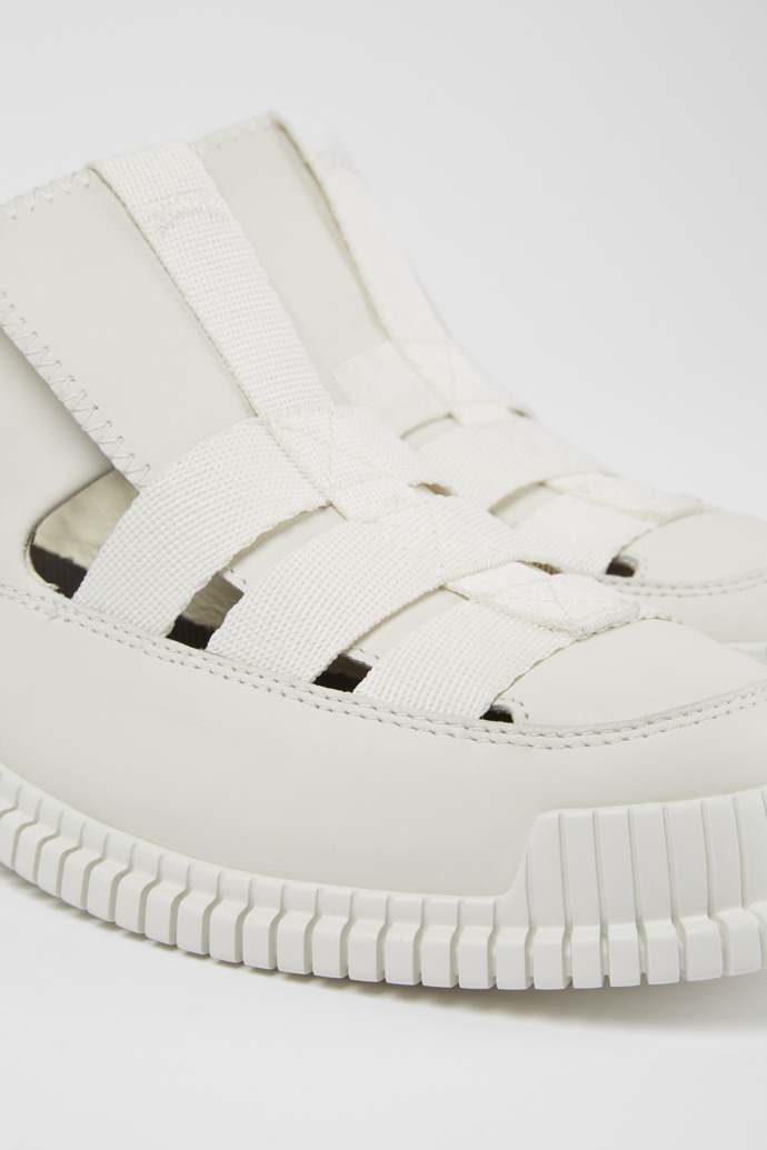 Close-up view of Pix White leather shoes