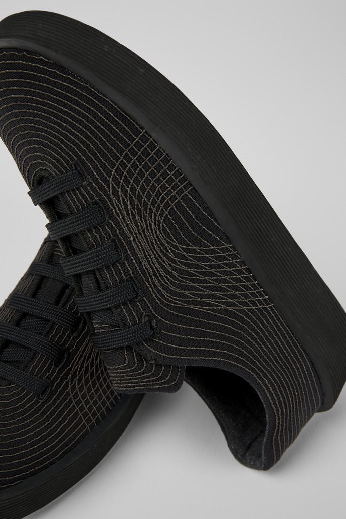 Close-up view of Courb Black sneakers for women