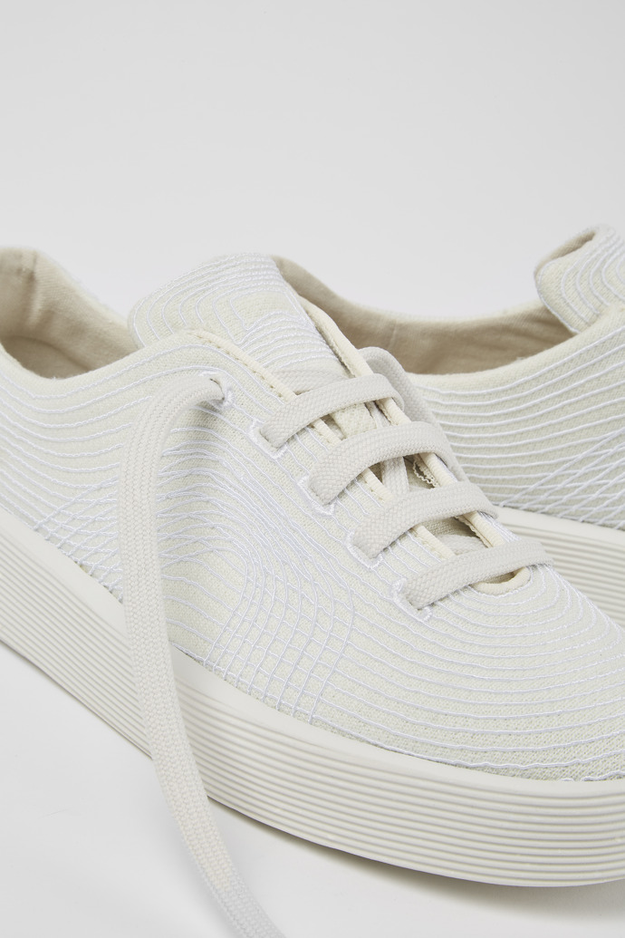 Close-up view of Courb White sneakers for women