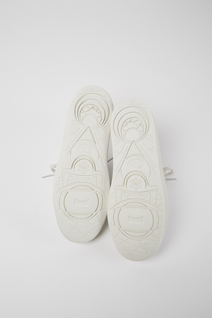 The soles of Courb White sneakers for women
