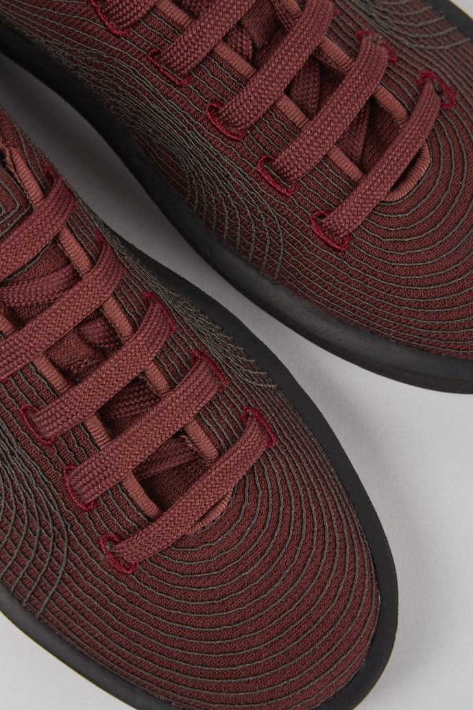 Close-up view of Courb Burgundy sneakers for women