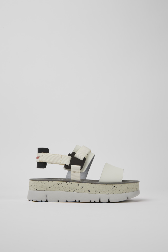Side view of Oruga Up White and black leather sandals for women