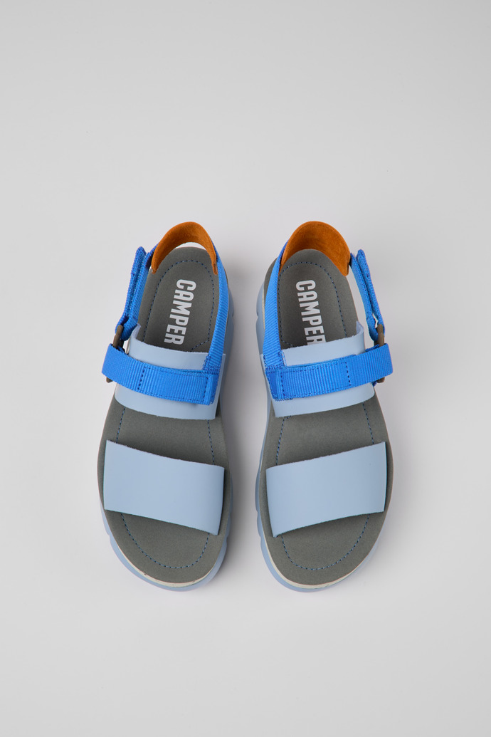 Overhead view of Oruga Up Blue and orange leather sandals for women