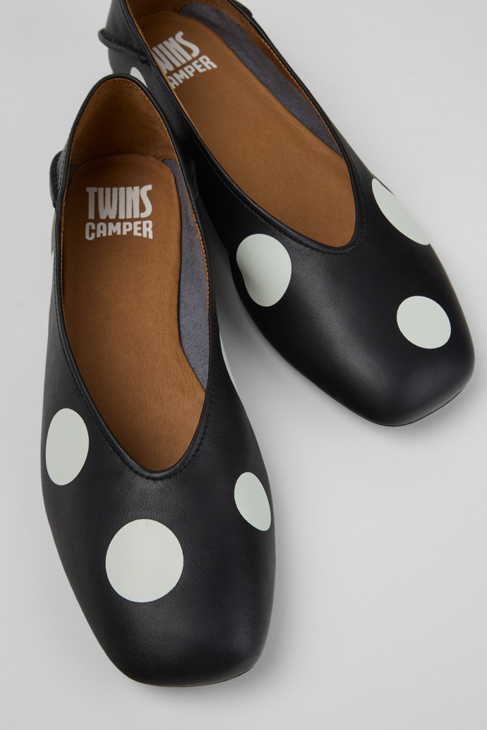 Close-up view of Twins Black and White Leather Ballerinas for Women.