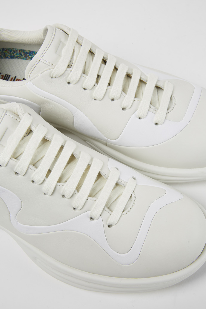 Close-up view of Twins Cream and white leather lace-up sneakers