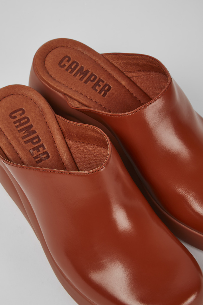 Close-up view of Kaah Brown leather clogs