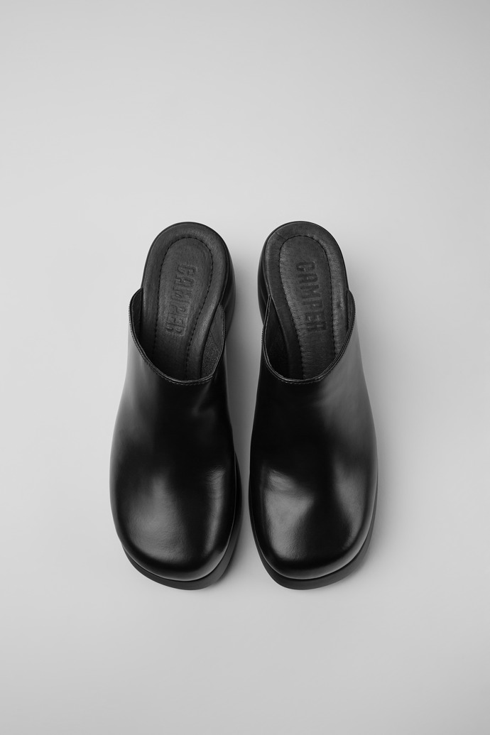 Overhead view of Kaah Black leather clogs