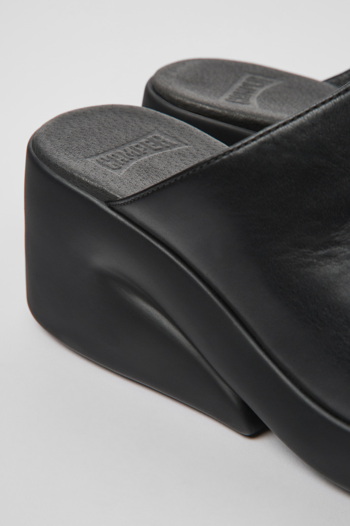 Close-up view of Kaah Black leather mules for women